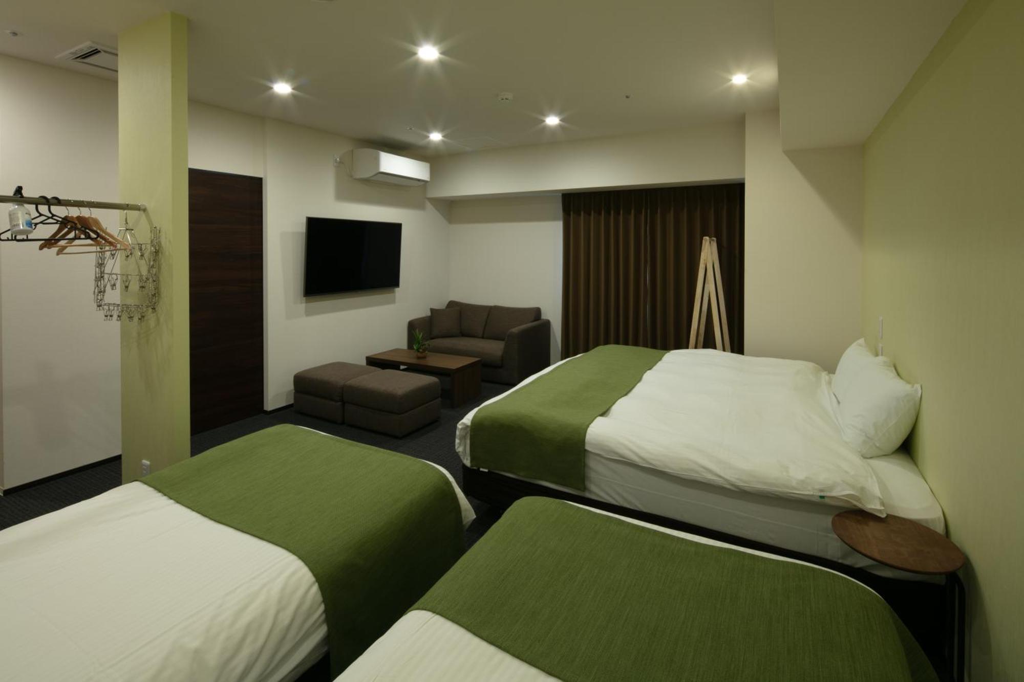 Randor Hotel Sapporo Suites חדר תמונה A room at the hotel